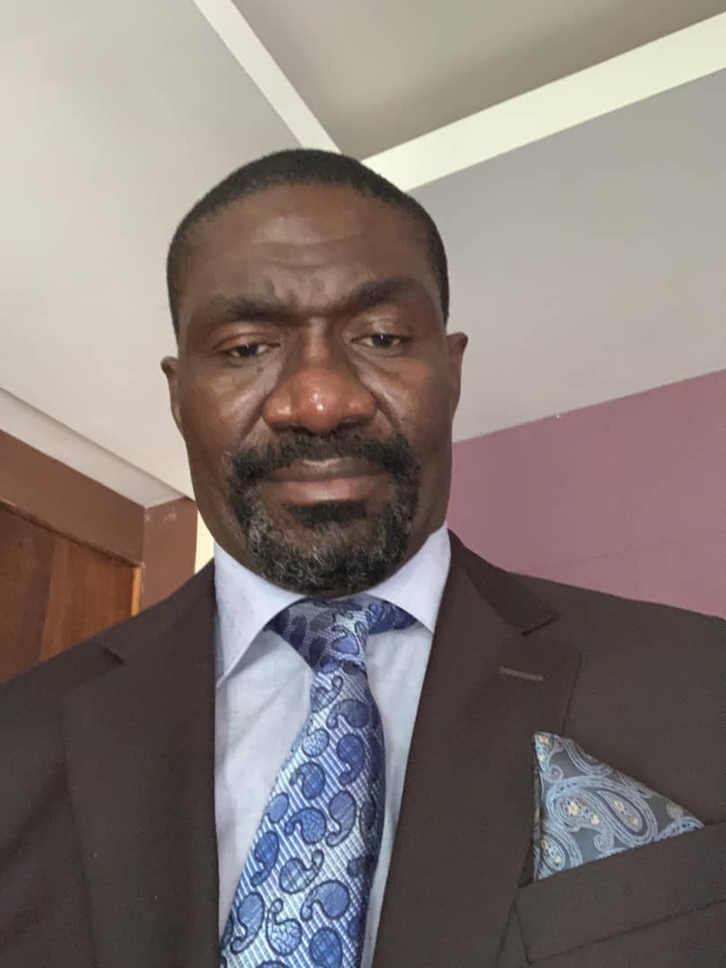 A portrait of Peter D. Mushi, Director